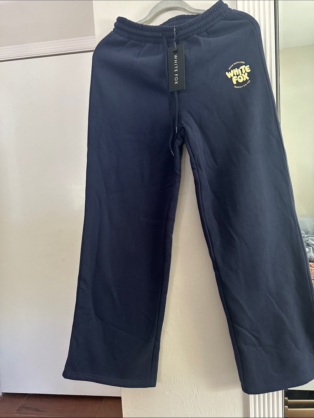 White Fox Boutique Navy Track Pants with Yellow Logo